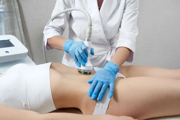 Lost the Weight but Not the Loose Skin? 2 woman having HIFU treatment on her stomach to combat loose skin Taunton following weight loss